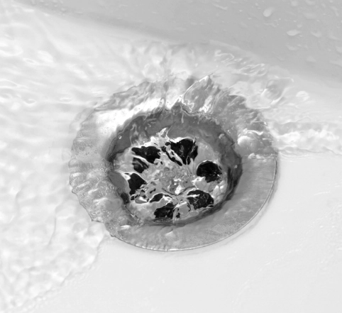 bathroom sink drain with flowing water